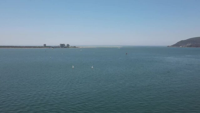 Aerial of the boats sailing in the sea in Setubal, Portugal