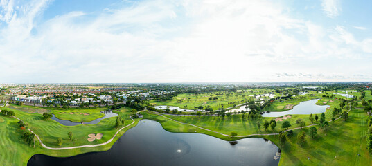 Wide panorama of Golf course beautiful Aerial view of golf field landscape with sunrise view in the...