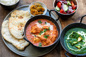 Butter chicken, saag paneer, toamto salad and naan bread