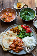 Butter chicken, saag paneer, toamto salad and naan bread