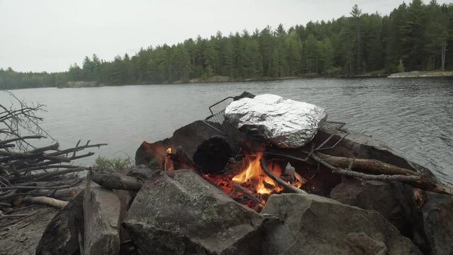 Footage of cooking a stake in foil on a campfire in Northern Ontario, Crownlands, Canadian tundra
