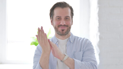 Portrait of Happy Young Man Clapping, Applauding