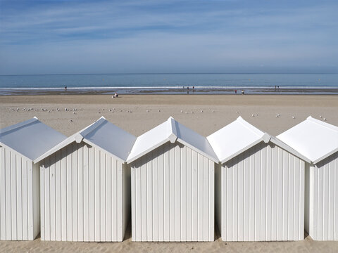 White beach cabins at Fort Mahon, a commune in the Somme department in Hauts-de-France in northern France. 