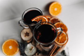 Composition of glasses with mulled wine. Spices for mulled wine (anise, cloves, cinnamon, cardamom,...