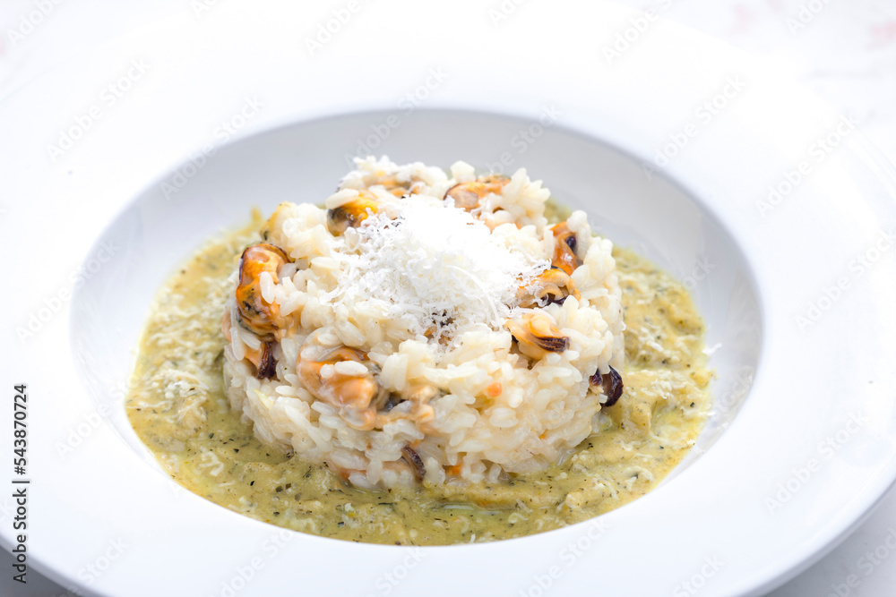 Wall mural risotto with mussels, sauce and parmesan cheese