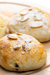 almond buns on wooden board