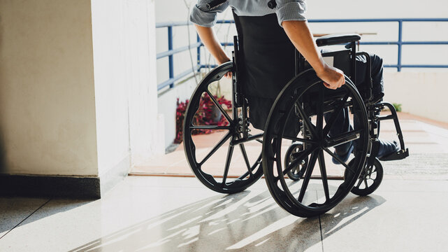Disabled man sitting in a wheelchair. People with disabilities can access anywhere in public place with wheelchair that make them independent in transportation.