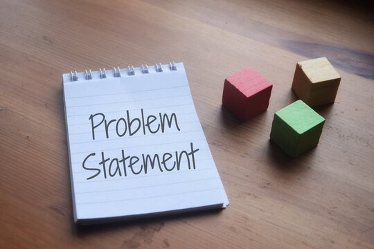 Problem Statement Wording Over A Wooden Table. Business And Education Concept 