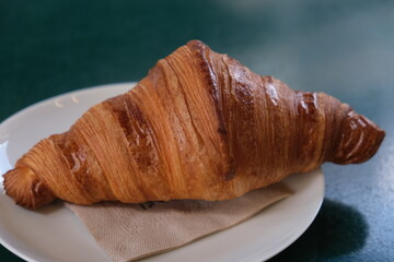 Fresh croissant on a plate