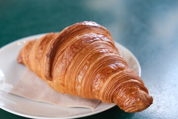 Fresh croissant on a plate