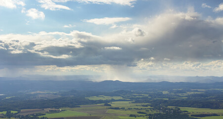 Fototapeta premium LIBEREC CZECH REPUBLIC MOUNTINE VIEW OF RAINY CLOUDS AND RAIN IN THE BACKGROUND