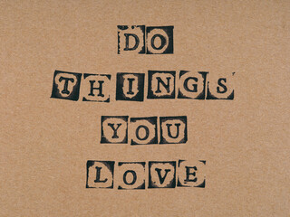 Cardboard with phrase Do Things You Love