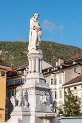 Fototapeta na wymiar Statue of mediaeval singer Walther von der Vogelweide in downtown Bolzano, autonomous province of South Tirol