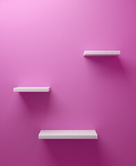 Set of three empty white shelves on a pink color wall
