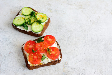 healthy sandwich with tomato, cucumber and parsley and ricotta isolated, close-up