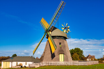Fototapeta na wymiar windmill in the village of the country