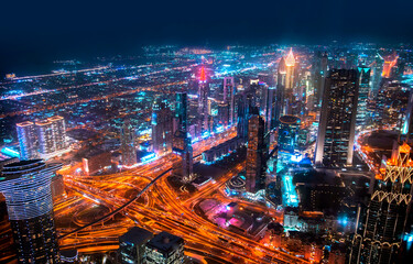Dubai city at night, view with lit up skyscrapers and roads.  