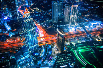 Plakat Dubai city at night, view with lit up skyscrapers and roads. 