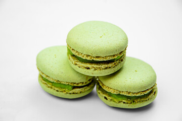 Pistachio macarone cake on a white background isolated close-up.