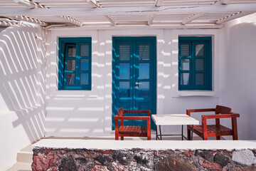 Traditional Greek White House with Blue windows and Door in Imerovigli Village - Santorini, Greece...