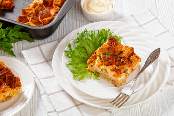 Scalloped Chicken Casserole topped with croutons