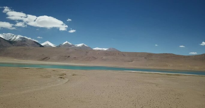 view of the lake snowcap mountains