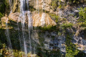 Detail of the water stream of Sotira river with waterfall in Summer 2022, Albania
