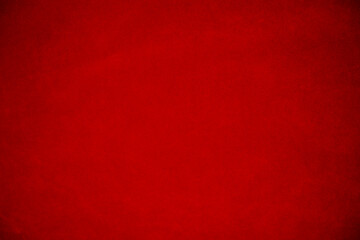 Red velvet fabric texture used as background. Empty red fabric background of soft and smooth textile material. There is space for text.