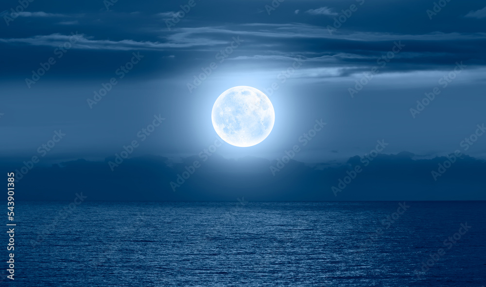 Poster night sky with moon in the dark clouds and darkblue sea in the foreground 
