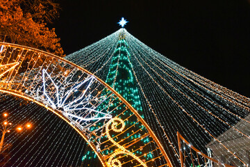 Christmas tree with festive lighting at night