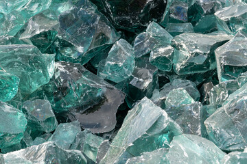 Heap of large Chunk of Aqua Glass Rock Slag for Garden decor. Glass in Nature Full frame texture top view