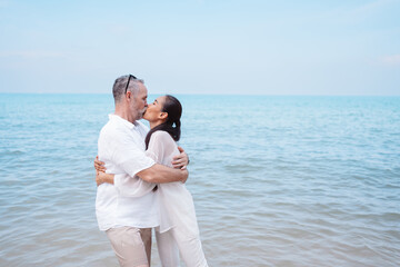 Happy couple senior eldery retirement resting at beach honeymoon family together happiness people lifestyle.