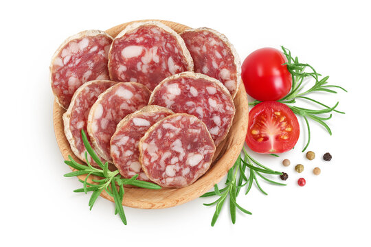 Cured salami sausage in wooden bowl isolated on white background. Italian cuisine with full depth of field. Top view. Flat lay.