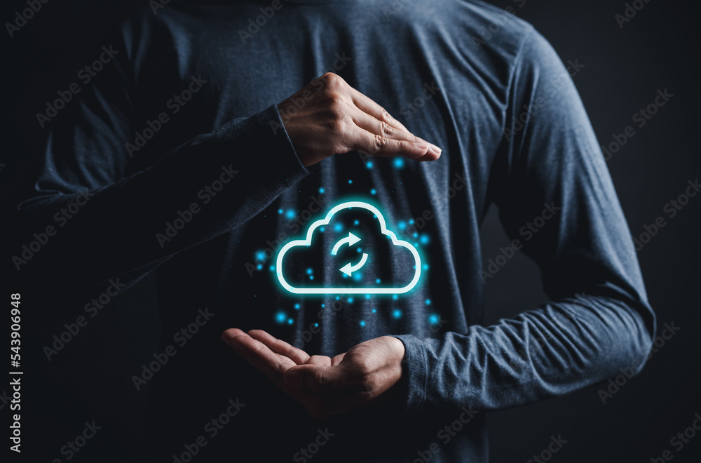 Fototapete Man holding virtual glowing cloud computing to download and loading data information and upload on system network application. Technology transformation concept