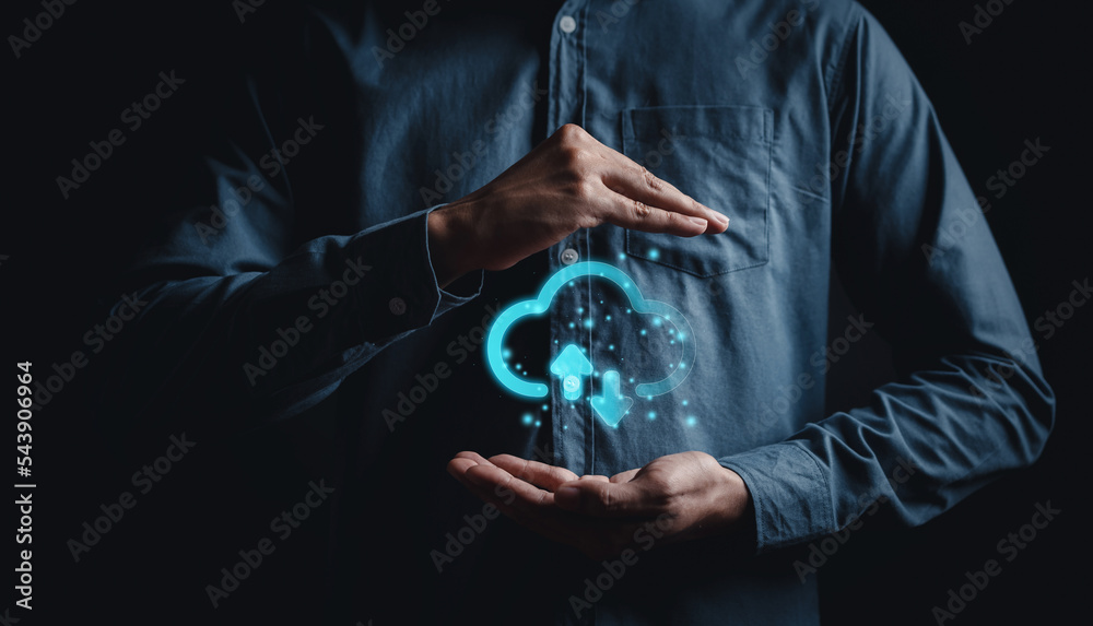 Fototapete Man holding virtual glowing cloud computing to download and loading data information and upload on system network application. Technology transformation concept