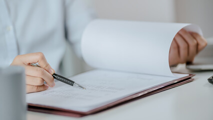 Asian business woman Hand writing ideas And taking notes