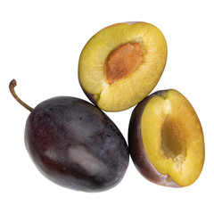 fresh ripe whole and cut plums isolated on white background, broken fruit in half with bone, top...