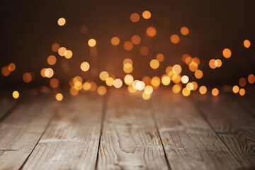 Christmas Bokeh Background -  Magic golden blurred lights on brown rustic wood - Backdrop for...