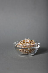 glass bowl of oatmeal isolated on gray background