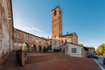 Carmagnola, Turin, Italy - November 05, 2022: entrance to the municipal offices located inside the ancient castle of Carmagnola with ancient tower