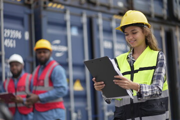 Caucasian engineer worman work in container port terminal. Female Industrial Engineer in Hard Hat,...