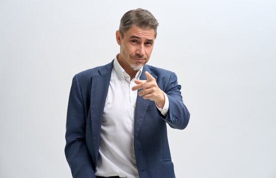 Business portrait of confident businessman. Salesman showing pointing at you. Entrepreneur in jacket smiling, Happy mid adult, mature age man standing, smiling, isolated on white background.