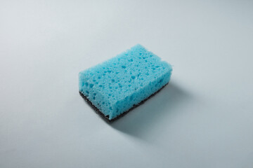 Blue sponge for washing dishes, side view