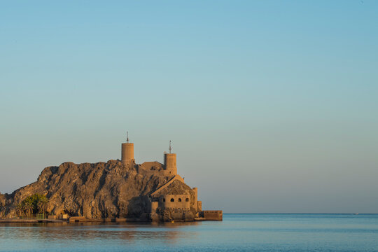 Muscat, Oman - March 05,2019 : View of the Al Jalali fortess at sunrise in the old town Muttrah.