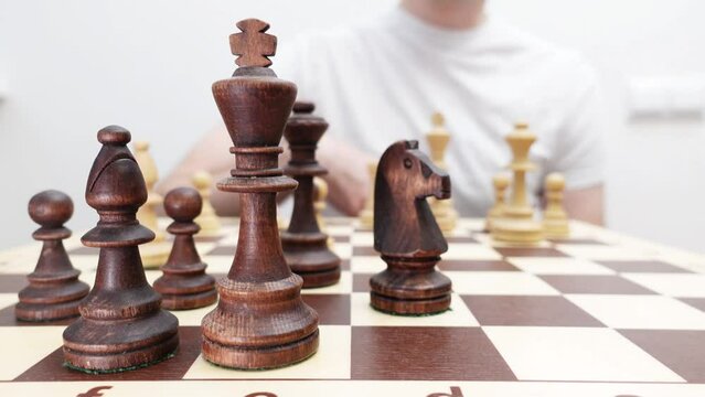 Hand moving chess game. Two players are playing chess.White win.Plan stratgy and tactic concept.Close up wooden chess pieces