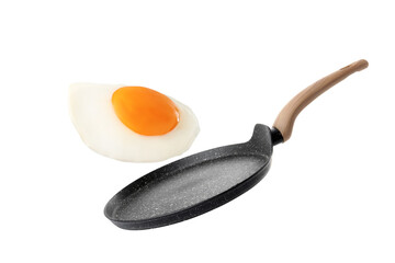 Tasty fried chicken egg falling into frying pan on white background