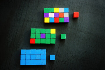 Three columns of colored cubes with leaders. Diversity and inclusion at workplace concept.