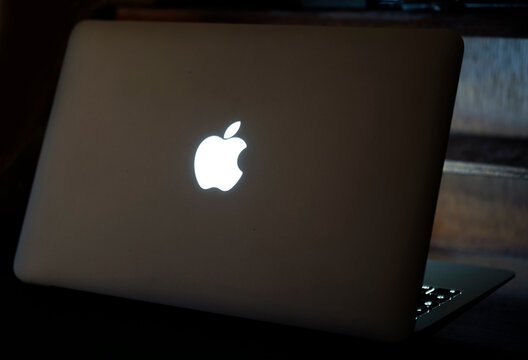 Itterbeck, Germany - Nov 3 2022 This older Macbook Air has an illuminated apple logo at the back of the lid