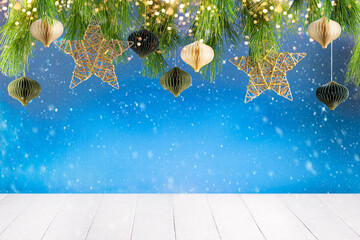 Christmas or New Year festive composition. Fir branches , gold Christmas decorations and paper...
