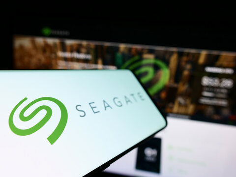 Stuttgart, Germany - 10-27-2022: Cellphone with logo of American data storage company Seagate Technology LLC on screen in front of website. Focus on left of phone display.